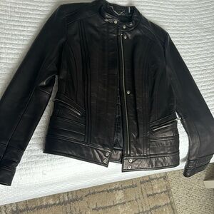 Black Rivet leather jacket, pre owned.